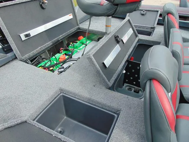 Slide: The Image of 2023 Ranger RT188C boat interior with open storage compartments and seating. - 10