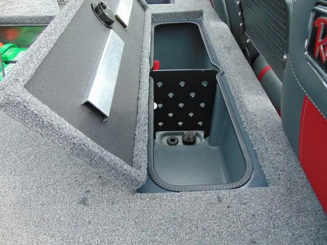 Slide: The Image of 2023 Ranger RT188C boat storage compartment with open lid, showcasing interior design and features. - 12