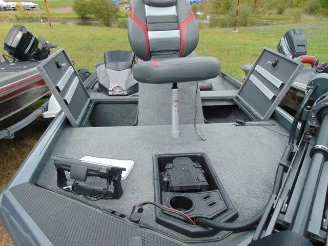 Slide: The Image of 2023 Ranger RT188C fishing boat interior with storage compartments and seating. - 13