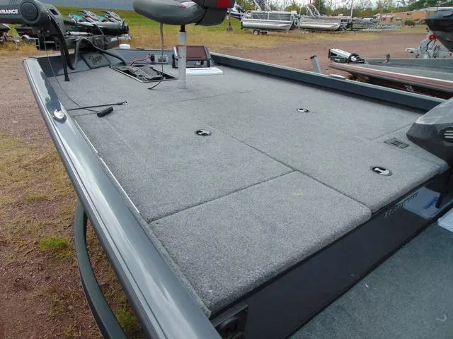 Slide: The Image of 2023 Ranger RT188C fishing boat deck with carpeted surface and seating. - 5