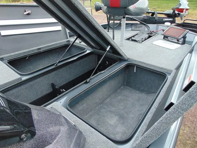 Slide: The Image of 2023 Ranger RT188C boat storage compartments open, showcasing spacious interior design. - 9