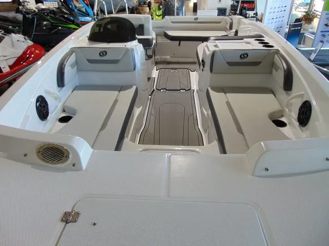 Slide: The Image of 2024 Hurricane SunDeck Sport 205 OB boat interior with spacious seating and modern design. - 3