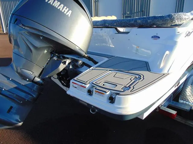 Slide: The Image of 2024 Hurricane SunDeck Sport 205 OB boat with Yamaha outboard motor, rear view. - 4