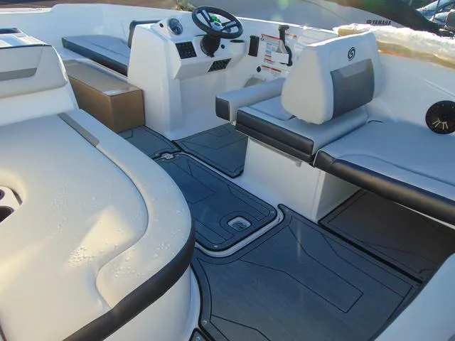 Slide: The Image of 2024 Hurricane SunDeck Sport 205 OB interior with sleek seating and modern dashboard. - 6