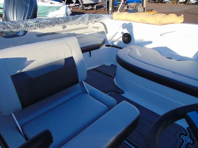 Slide: The Image of 2024 Hurricane SunDeck Sport 205 OB interior with seating and steering wheel. - 9