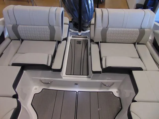Slide: The Image of 2024 Hurricane SunDeck 2600 OB boat interior with plush seating and modern design. - 7