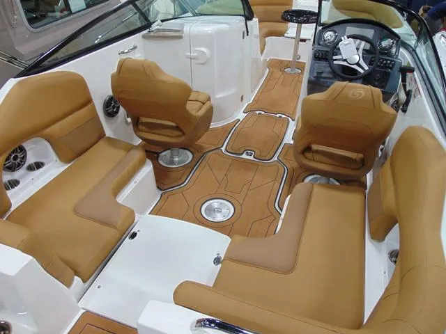 Slide: The Image of 2025 Hurricane SunDeck 2486 OB interior with tan seating and modern dashboard. - 3