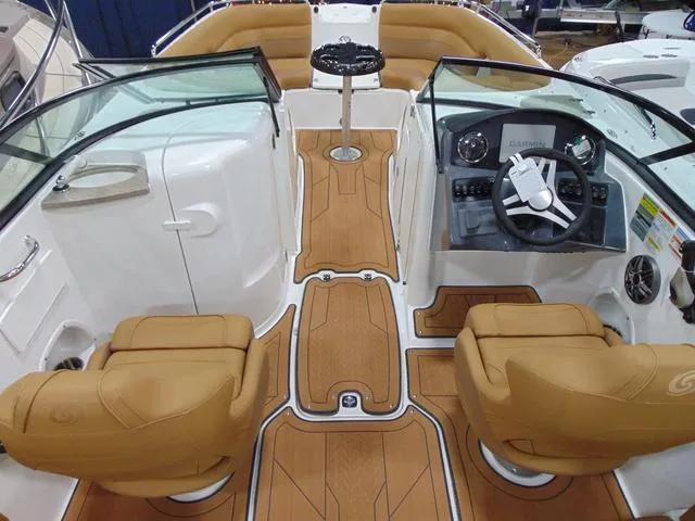 Slide: The Image of 2025 Hurricane SunDeck 2486 OB boat interior with tan seating and modern dashboard. - 4