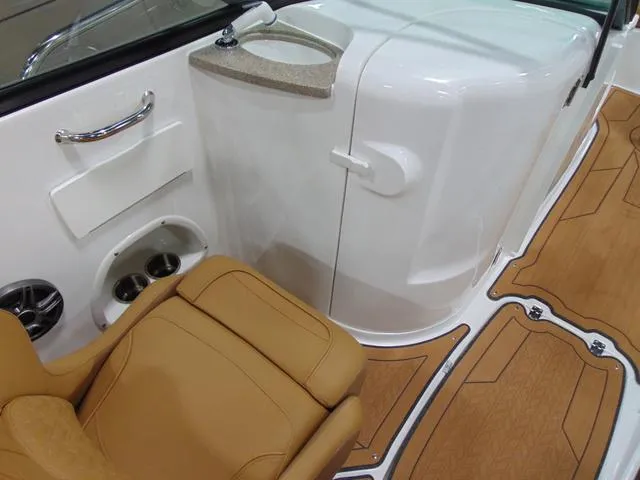 Slide: The Image of 2025 Hurricane SunDeck 2486 OB interior with tan seating and sleek white console. - 7