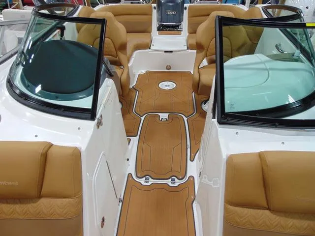 Slide: The Image of 2025 Hurricane SunDeck 2486 OB interior with tan seating and sleek design. - 9