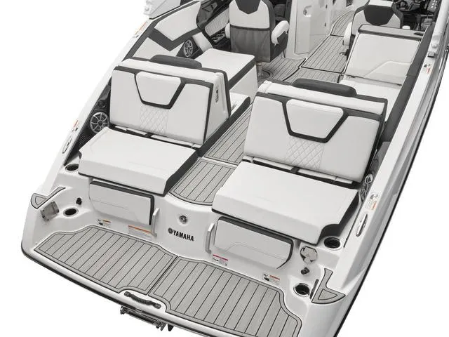 Slide: The Image of 2025 Yamaha Boats 252S interior seating with cup holder and speaker detail. - 5