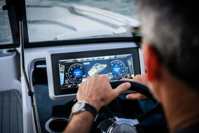 Slide: The Image of 2025 Yamaha Boats 252S steering console with touchscreen and controls. - 9