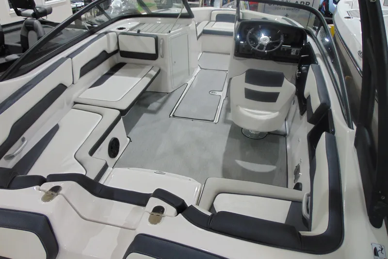 Slide: The Image of 2025 Yamaha Boats AR195 interior with sleek seating and modern dashboard design. - 10
