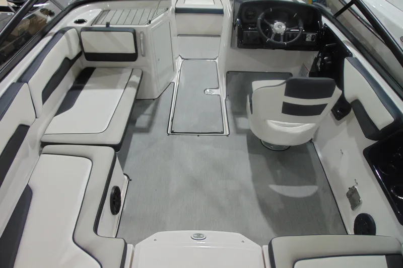 Slide: The Image of 2025 Yamaha Boats AR195 interior with sleek seating and modern steering console. - 11