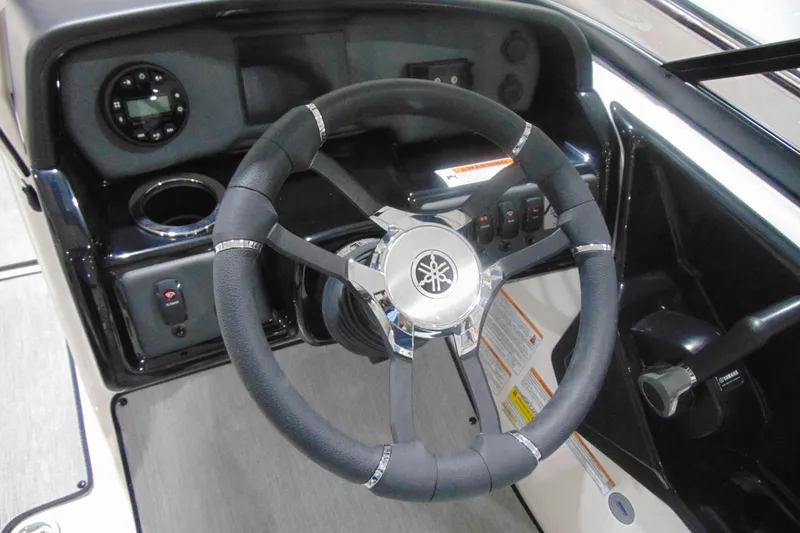 Slide: The Image of Steering wheel of 2025 Yamaha Boats AR195, featuring sleek design and modern controls. - 18
