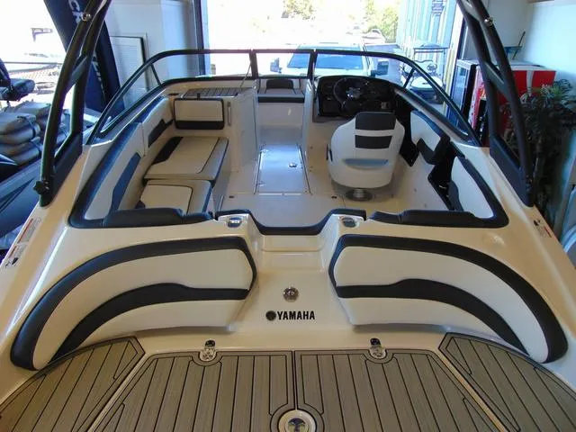 Slide: The Image of 2025 Yamaha Boats AR195 interior with sleek seating and modern design. - 2