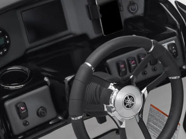 Slide: The Image of 2025 Yamaha AR195 boat dashboard with steering wheel and control panel. - 5
