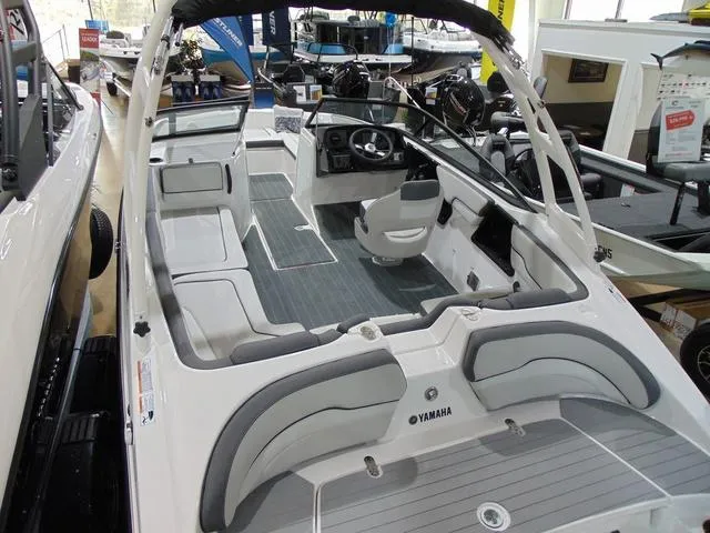 Slide: The Image of 2025 Yamaha Boats AR190 interior with sleek seating and modern dashboard. - 10