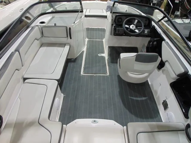 Slide: The Image of 2025 Yamaha Boats AR190 interior with seating and steering console, featuring modern design and spacious layout. - 11