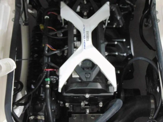 Slide: The Image of 2025 Yamaha Boats AR190 engine compartment with visible components and wiring. - 16