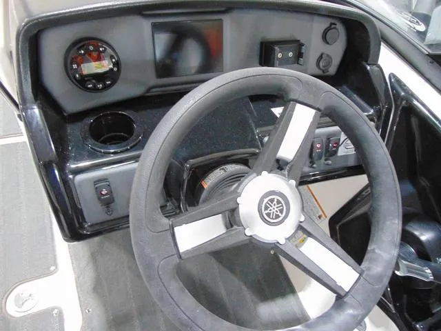 Slide: The Image of 2025 Yamaha Boats AR190 dashboard with steering wheel and control panel. - 17