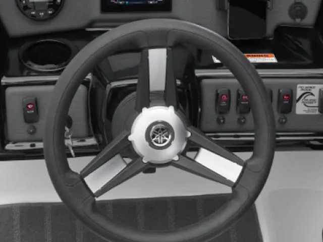 Slide: The Image of Steering wheel of 2025 Yamaha Boats AR190, featuring control panel and switches. - 6
