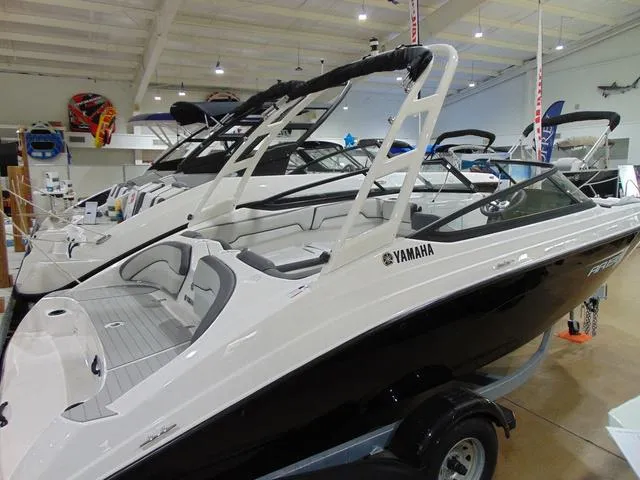 Slide: The Image of 2025 Yamaha Boats AR190 displayed in a showroom, featuring sleek design and modern amenities. - 7