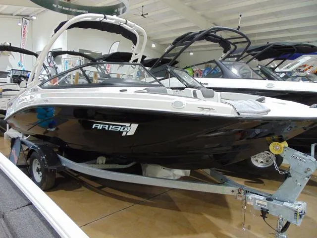 Slide: The Image of 2025 Yamaha Boats AR190 displayed indoors on a trailer. - 9