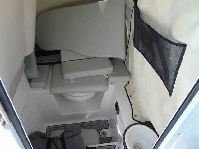 Slide: The Image of 2022 Sea Fox 249 Avenger boat interior with seating and storage area. - 13