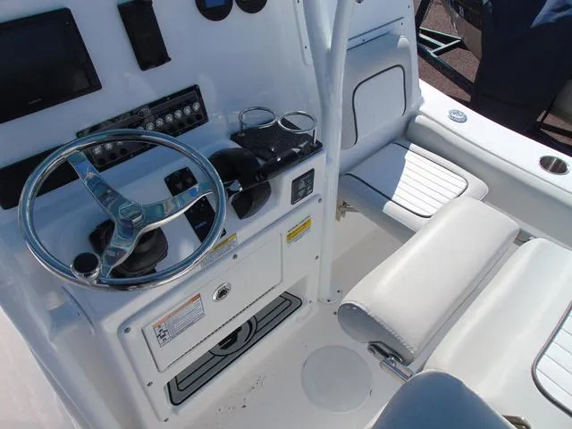 Slide: The Image of 2022 Sea Fox 249 Avenger boat cockpit with steering wheel and controls. - 14