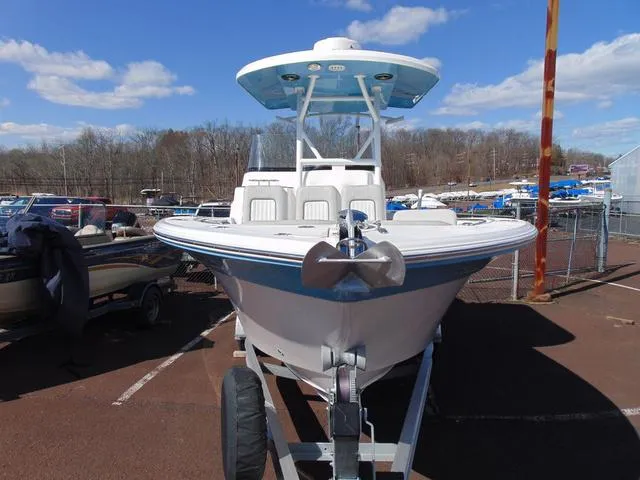 Slide: The Image of 2022 Sea Fox 249 Avenger boat on trailer under clear sky. - 4