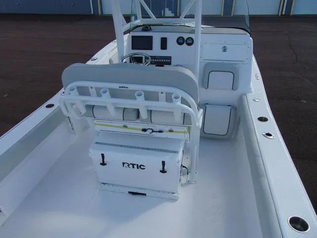 Slide: The Image of 2022 Sea Fox 249 Avenger boat interior with seating and console, featuring RTIC cooler. - 8