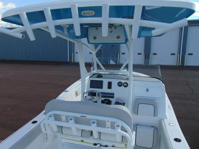 Slide: The Image of 2022 Sea Fox 249 Avenger boat interior with helm, seating, and storage compartments. - 9