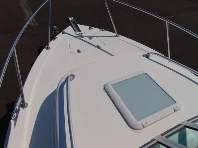 Slide: The Image of 2011 Sea Chaser 2100 Walk-Around boat deck with hatch and railing. - 16