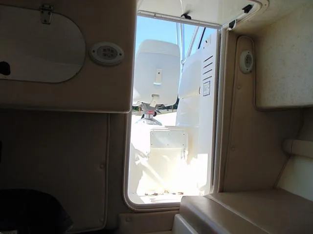 Slide: The Image of 2011 Sea Chaser 2100 Walk-Around cabin interior with open door view. - 18