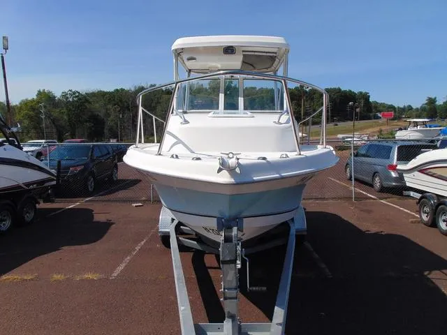 Slide: The Image of 2011 Sea Chaser 2100 Walk-Around boat on trailer in parking lot. - 3