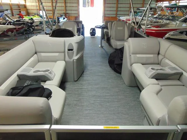Slide: The Image of 2024 Godfrey Pontoons Xperience 2286 SBX helm with steering wheel and controls. - 10