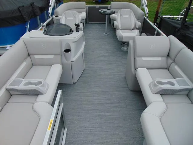 Slide: The Image of 2024 Godfrey Pontoons Xperience 2286 SBX with Mercury 20 engine, showcased indoors. - 3