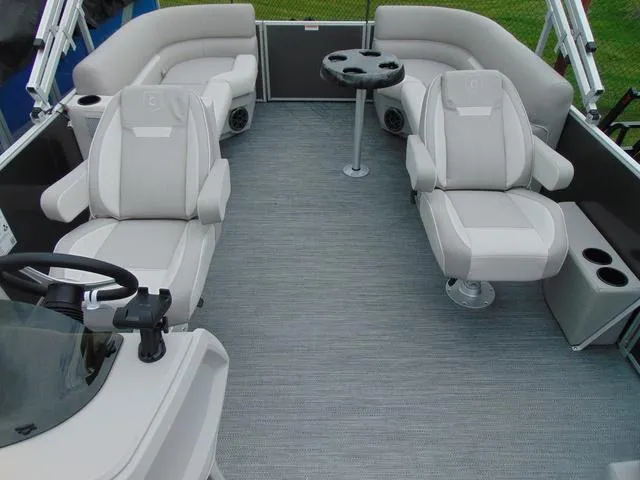 Slide: The Image of 2024 Godfrey Pontoons Xperience 2286 SBX, silver pontoon boat with spacious seating, docked outdoors. - 4