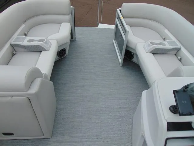 Slide: The Image of 2024 Godfrey Pontoons Xperience 2286 SBX interior with plush seating and modern helm. - 9