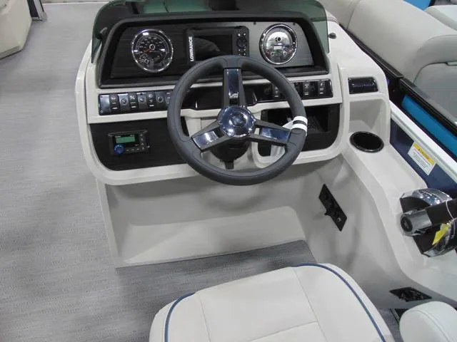Slide: The Image of 2025 Godfrey Pontoons Sweetwater 2286 MT interior with spacious seating and modern dashboard. - 10