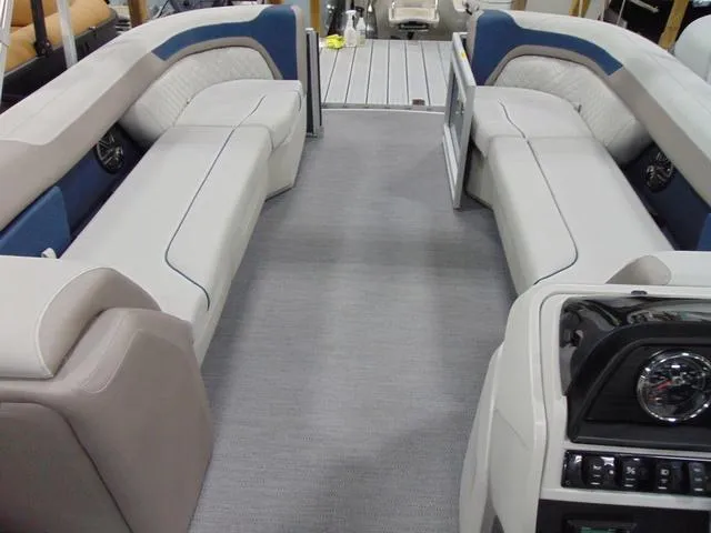 Slide: The Image of 2025 Godfrey Pontoons Sweetwater 2286 MT interior with spacious seating and modern dashboard. - 11