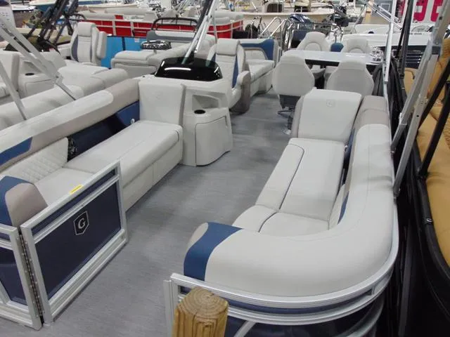 Slide: The Image of 2025 Godfrey Pontoons Sweetwater 2286 MT interior with plush seating and modern design. - 2