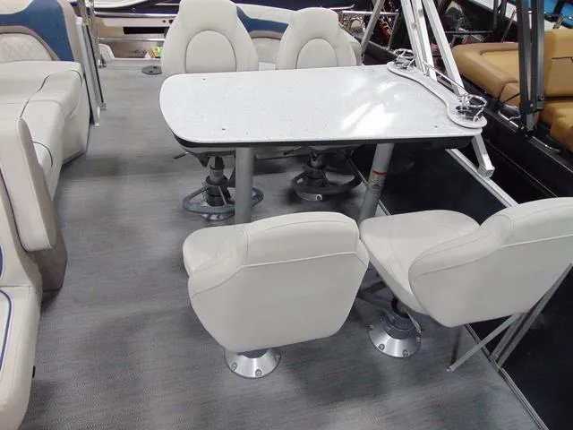 Slide: The Image of Interior of 2025 Godfrey Pontoons Sweetwater 2286 MT, featuring plush seating and modern steering. - 5