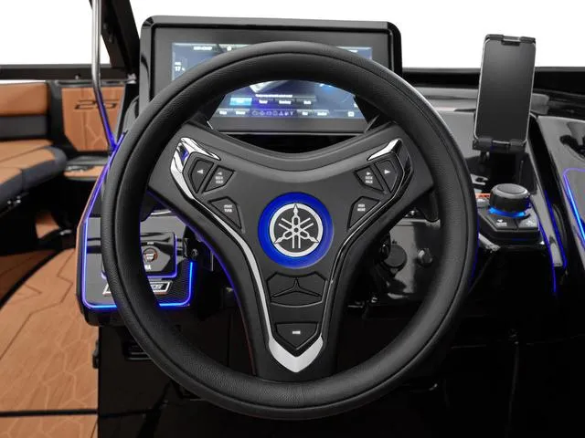 Slide: The Image of Steering wheel of 2025 Yamaha Boats 255XD with modern dashboard and controls. - 6