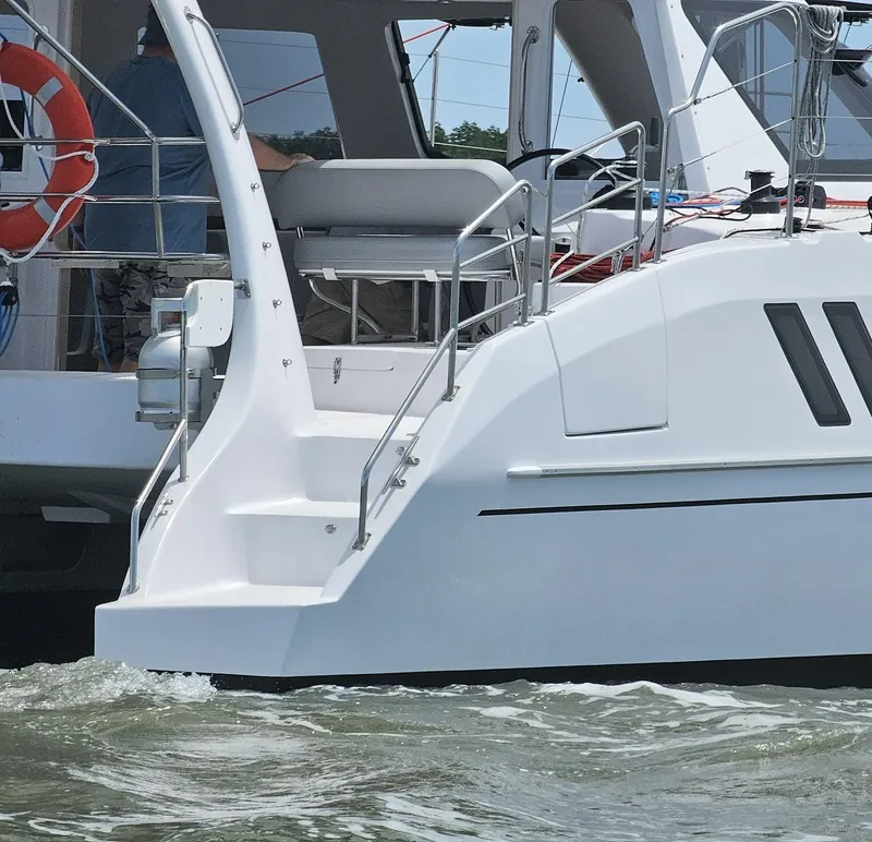 Slide: The Image of 2025 Seawind 1160 XL catamaran on water, featuring sleek design and modern amenities. - 5