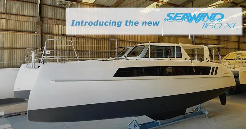 Slide: The Image of Introducing the 2025 Seawind 1160 XL catamaran in a boatyard setting. - 8