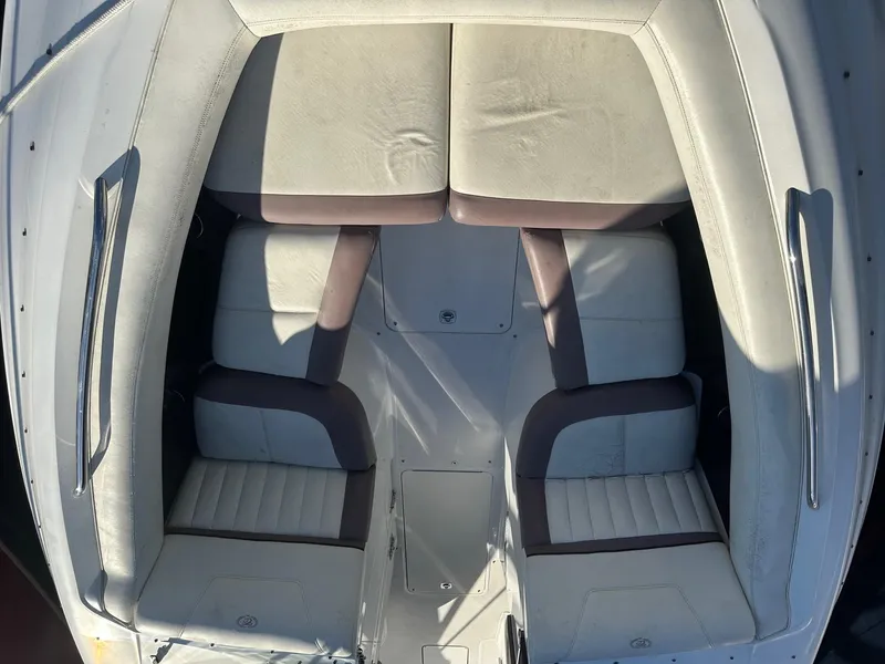 Slide: The Image of 2012 Cobalt 302 boat interior with white and gray seating, top view. - 23