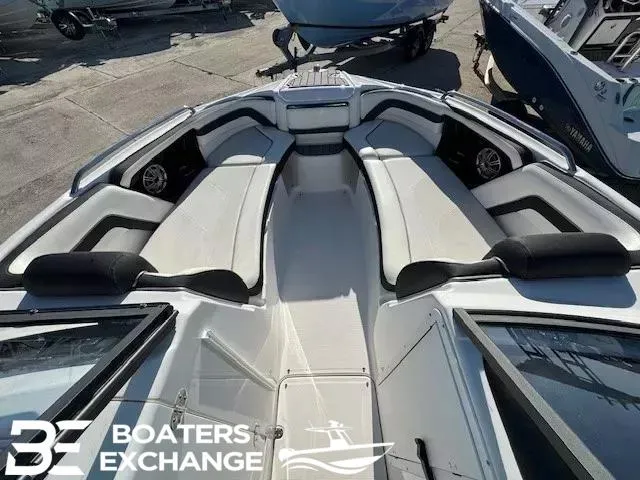 Slide: The Image of 2016 Yamaha Boats 242 LTD S interior with spacious seating and sleek design. - 11