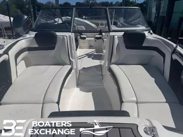Slide: The Image of 2016 Yamaha Boats 242 LTD S interior with spacious seating and windshield, at Boaters Exchange. - 12